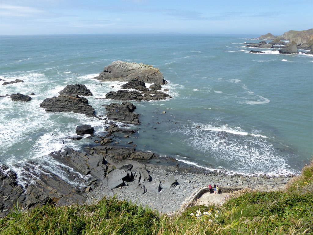 best dog-friendly beaches devon - Beach and coastline rocks by Hartland Quay, Devon